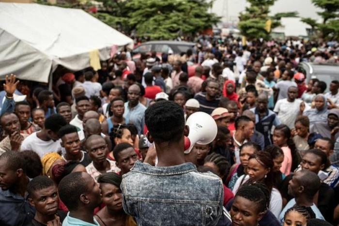 Election call: People in Lagos gathered ahead of polling day to pick up the biometric card entitling them to vote