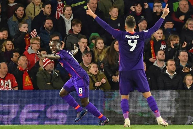 Liverpool's Guinean midfielder Naby Keita (L) celebrates after scoring their first goal during the English Premier League football match between Southampton and Liverpool at St Mary's Stadium in Southampton, southern England on April 5, 2019.