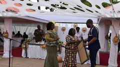 Frederick Mwenvil Dibkuu presents artwork to Chief of Staff