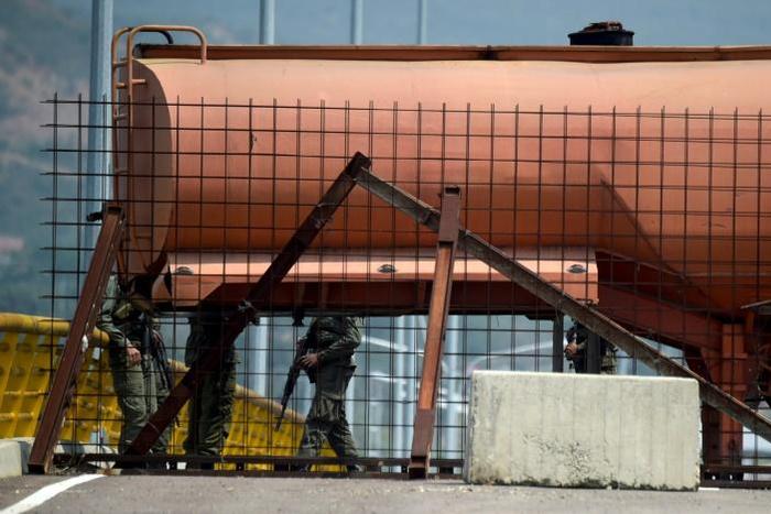 Venezuelan soldiers using containers to block the Tienditas Bridge, which links Tachira, Venezuela, and Cucuta, Colombia, on February 6, 2019
