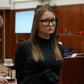 Fake German heiress Anna Sorokin is led away after being sentenced in Manhattan Supreme Court following her conviction last month on multiple counts of grand larceny and theft of services