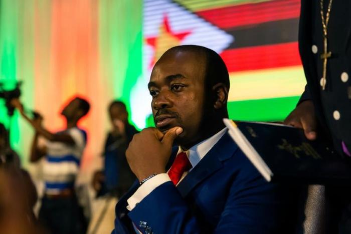 Zimbabwean opposition leader Nelson Chamisa of the MDC Alliance listens to participants during a prayer as part of a meeting organized by a coalition of Christian churches to facilitate dialogue between political party leaders,