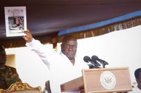 President Nana Addo Dankwa Akufo-Addo displaying the Ghana Beyond Aid document at the May Day celebrations in Accra