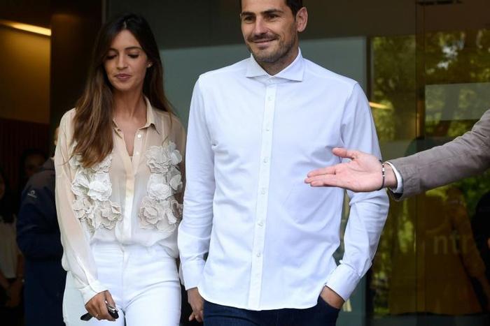 Casillas leaves hospital with his wife on Monday after suffering a heart attack last month