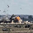 Smoke and fire billow after shelling of the Islamic State group's last holdout of Baghouz, a village in eastern Syria