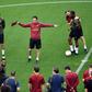 Arsenal coach Unai Emery talks to his players as they train at the Baku Olympic Stadium on the eve of the Europa League final against Chelsea