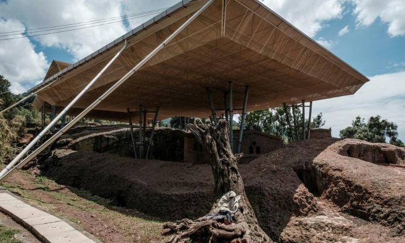 Massive shelters have been erected to protect the ancient stone-carved churches