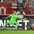 Marvin Friedrich (2L) deflected in a shot from Stuttgart's Mario Gomez (R) before equalising for Union Berlin