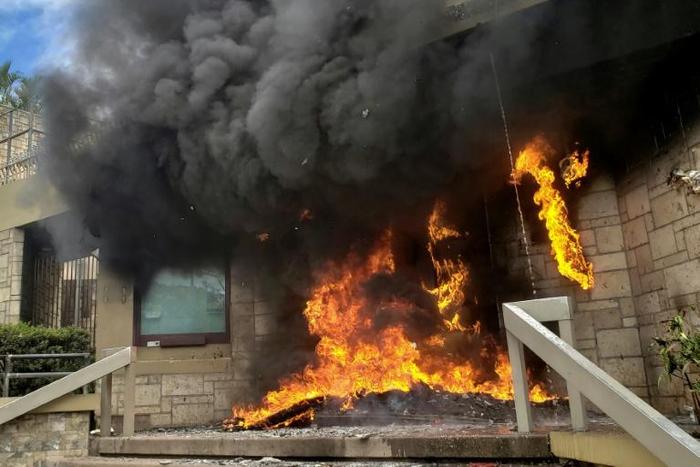 Firefighters came to extinguish the blaze, which destroyed the diplomatic mission's gate without damaging the main embassy building