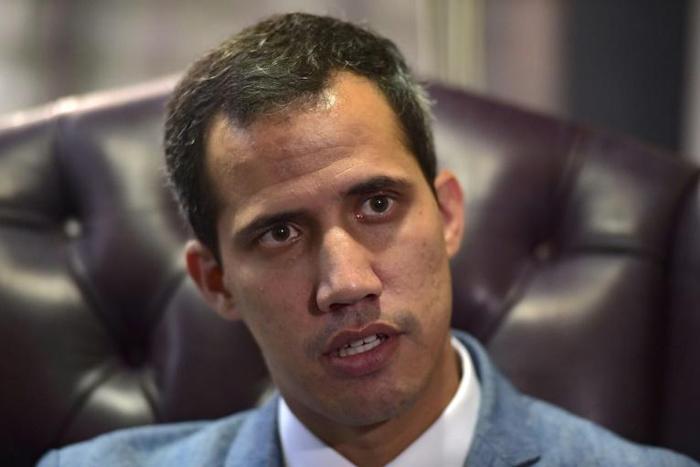 The head of Venezuela's National Assembly and self-proclaimed acting president Juan Guaido speaks during an exclusive interview with AFP in Caracas on February 8, 2019