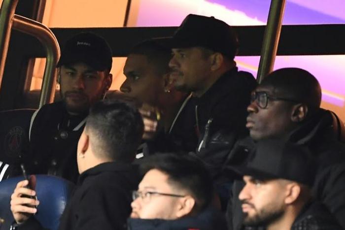 Neymar (left) watched PSG's March 6 defeat to Manchester United from the stands
