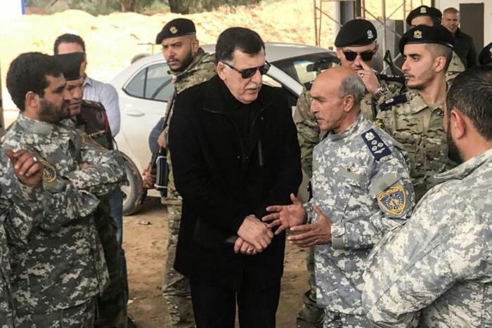 Fayez al-Sarraj (C) is head of Libya's Government of National Accord