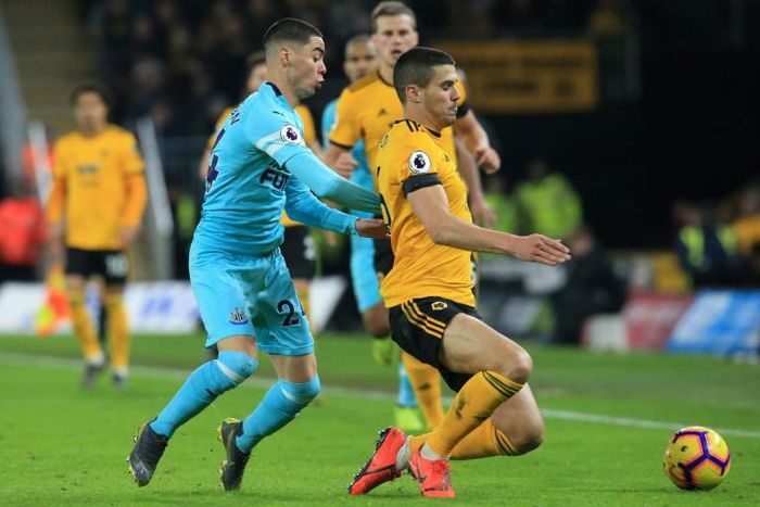 Newcastle's Miguel Almiron challenges Wolves' Conor Coady