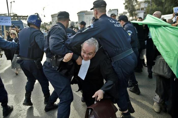 Algerian police disperse a protest by lawyers against ailing President Abdelaziz Bouteflika's bid for a fifth term in power