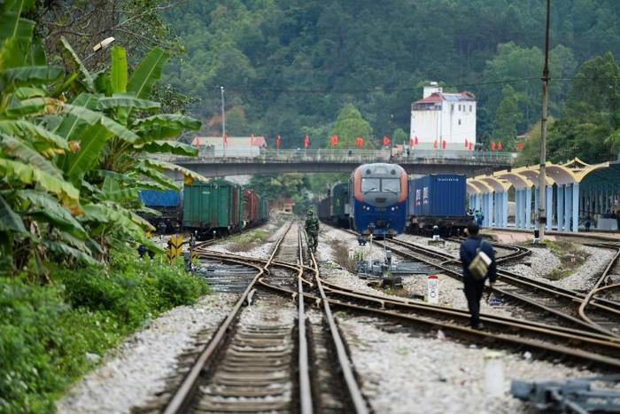 A Vietnamese soldier and railway worker inspect the track near the Dong Dang railway station, where North Korean leader Kim Jong Un is expected to arrive ahead of his summit with US President Donald Trump