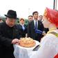 Kim was greeted by women in folk costumes with bread and salt in a traditional greeting