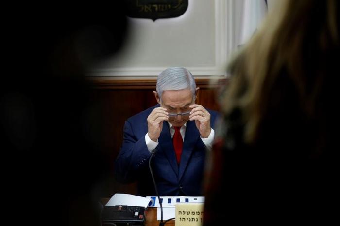 Israeli Prime Minister Benjamin Netanyahu opens the weekly cabinet meeting at his Jerusalem office on February 10