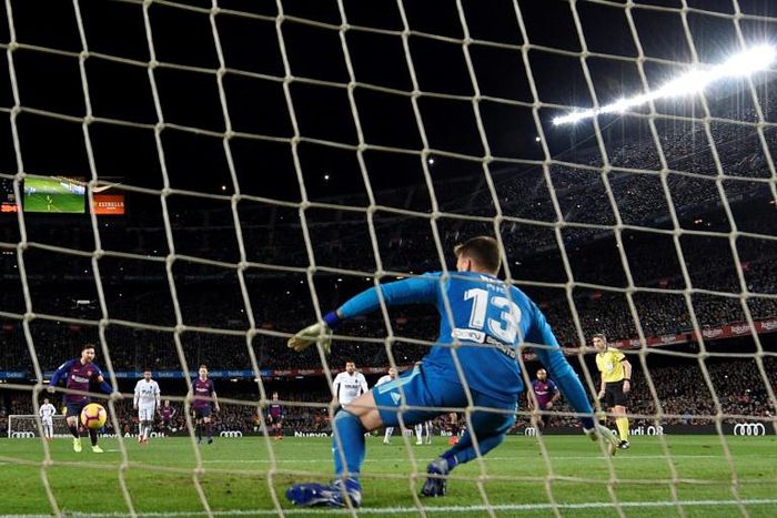Lionel Messi scored twice, the first from the spot, to save a point for Barcelona against Valencia