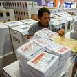 An official prepares ballot boxes and other voting materials in Jakarta ahead of elections next week. Indonesia is investigating vote-rigging claims after thousands of ballot papers were disovered in neighbouring Malaysia