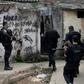 Brazilian military police (similar to the ones pictured June 2018) said they "shot 12 criminals" during an operation to stop a firefight between two drug-trafficking gangs in the Fallet, Fogueteiro and Coroa favelas