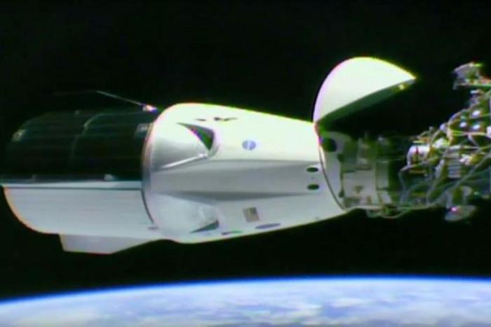 This video grab taken from the NASA/SpaceX webcast transmission on March 3, 2019, shows a SpaceX Falcon 9 rocket docked with the International Space Station (ISS) during the Demo-1 mission