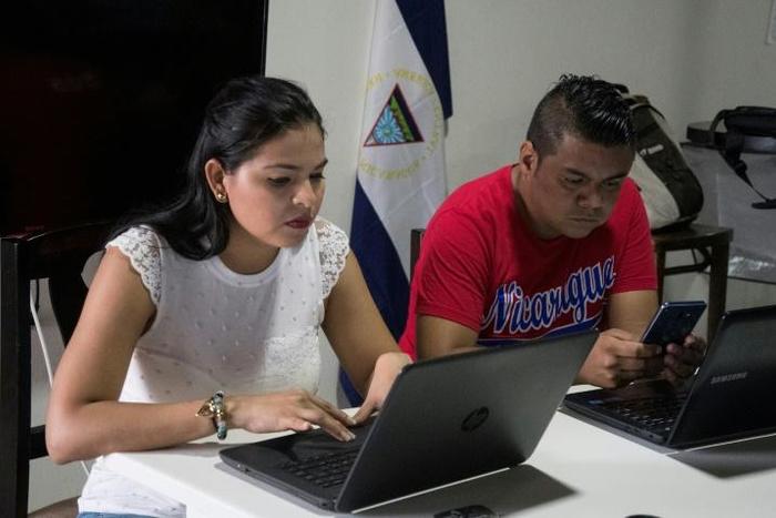 Leticia Gaitan and Hector Rosales, presenters for the Nicaragua Actual news program, prepare their report from a small apartment near San Jose, Costa Rica, where they fled to escape persecution by the Nicaraguan regime of President Daniel Ortega