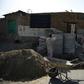Afghan labourers work in September 2018 to rebuild a wrestling club that was destroyed earlier that month by a double bombing, for which two of the operatives have been arrested