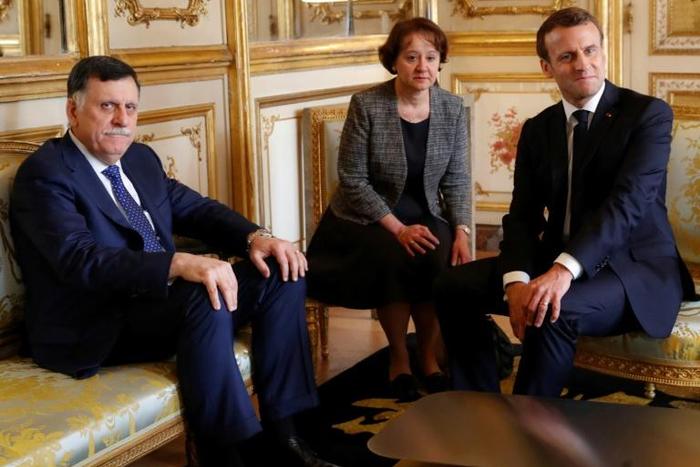 Libyan Prime Minister Fayez al-Sarraj (l) with French President Emannuel macron at the Elysee Palace in Paris