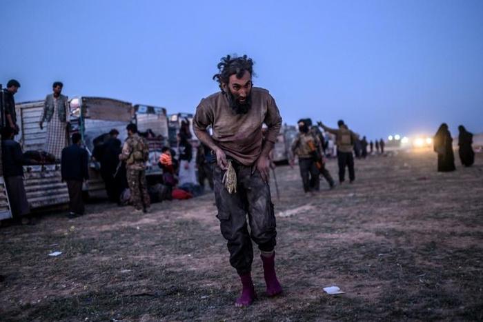 Suspected members of the Islamic State group are among thousands leaving the jihadists' last Syrian stronghold