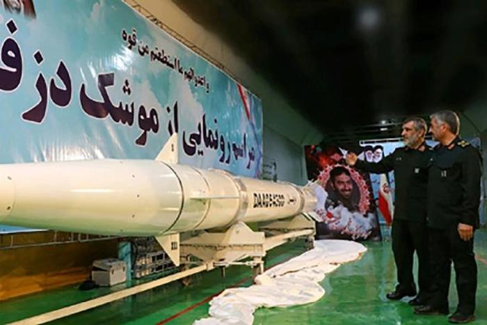 Iranian Revolutionary Guards commander-in-chief Mohammad Ali Jafari (R) views the new "Dezful" missile, during an unveiling ceremony at an undisclosed location on February 7, 2019