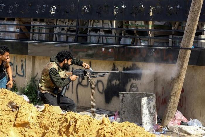 Fighters loyal to Libya's UN-backed government are defending the capital from a rival strongman's forces