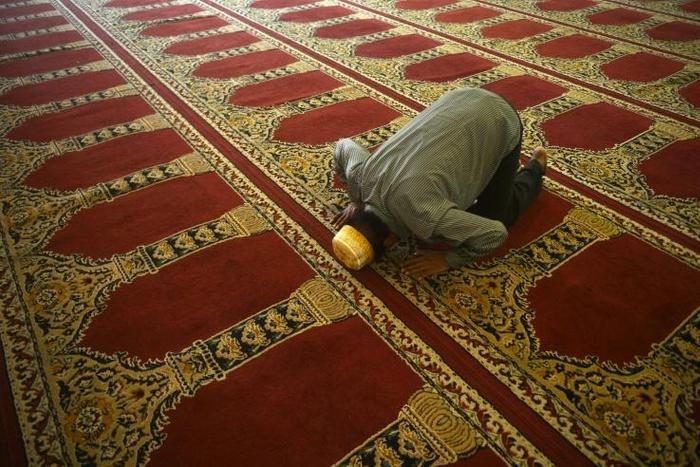 A man prays at the Dawatagaha Jumma Masjid mosque in Colombo. Sri Lankan Muslim groups say they warned authorities about the increased radicalisation of Easter Sunday attack ringleader Zahran Hashim