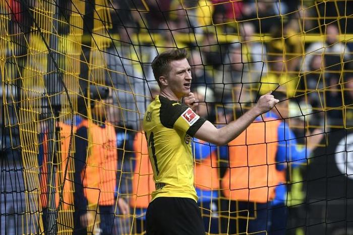 Marco Reus was sent off as Dortmund suffered a critical blow to their title race hopes with a derby defeat on Saturday
