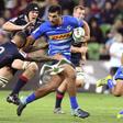 Damian de Allende (R) shrugs off a tackle from Rebels player Quade Cooper (2/L) on the way to scoring a try as the Stormers cruised to a 41-24 victory