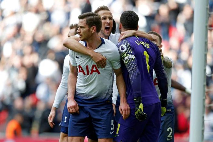 Hugo Lloris (right) saved a last-minute penalty to salvage Tottenham a point against Arsenal