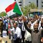 Sudanese protesters gather during a demonstration outside the Central Bank in Khartoum on May 29, 2019