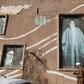 A Muslim Shiite cleric walks past the house of the late founder of the Islamic Republic, Ayatollah Ruhollah Khomeini, in the holy city of Qom