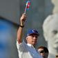 Miguel Diaz-Canel's (L) first year as president of Cuba has been anything but straightforward
