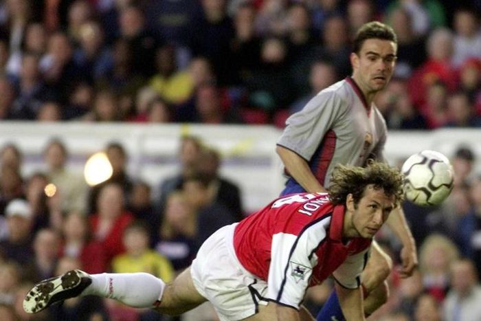 Gilles Grimandi (L), pictured during his playing days as a defender with Arsenal in 2001, will rejoin ex-Gunners teammate Patrick Vieira