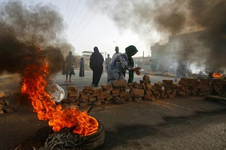 Sudanese protesters close Street 60 with burning tyres and pavers as military forces tried to disperse a sit-in outside Khartoum's army headquarters on June 3, 2019.At least two people were killed Monday as Sudan's military council tried to break up a ...
