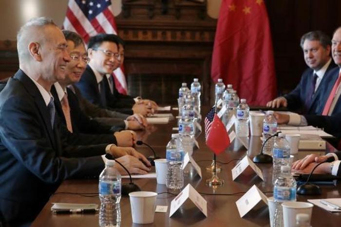 Chinese trade envoy Liu He smiles during talks in Washington in January