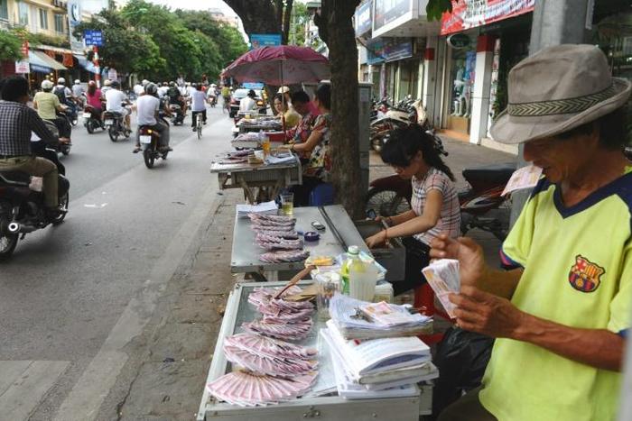 Vendors sell tickets for the lottery in Hanoi - one of the only legal forms of gambling in Vietnam