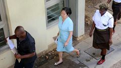 Yang Fenglan (centre), seen here as she entered court at the start of her trial in 2016, has been dubbed the 'Ivory Queen' for her role in trafficking