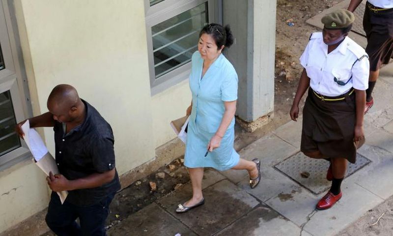Yang Fenglan (centre), seen here as she entered court at the start of her trial in 2016, has been dubbed the 'Ivory Queen' for her role in trafficking