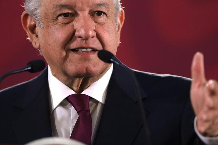 Handout photo released by the Mexican presidency showing Mexico's President Andres Manuel Lopez Obrador during a press conference at the National Palace, in Mexico City on April 8, 2019. AMLO said he was willing to offer an apology to the United States...