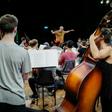 James Ross (C) conducts the Cuban American Youth Orchestra during a rehearsal at Havana's National Theater