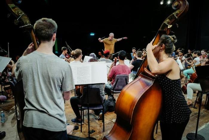 James Ross (C) conducts the Cuban American Youth Orchestra during a rehearsal at Havana's National Theater