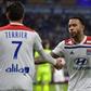 Lyon's Dutch forward Memphis Depay (R) reacts with French midfielder Martin Terrier during the French L1 football match against Angers in Decines-Charpieu, near Lyon, central-eastern France.