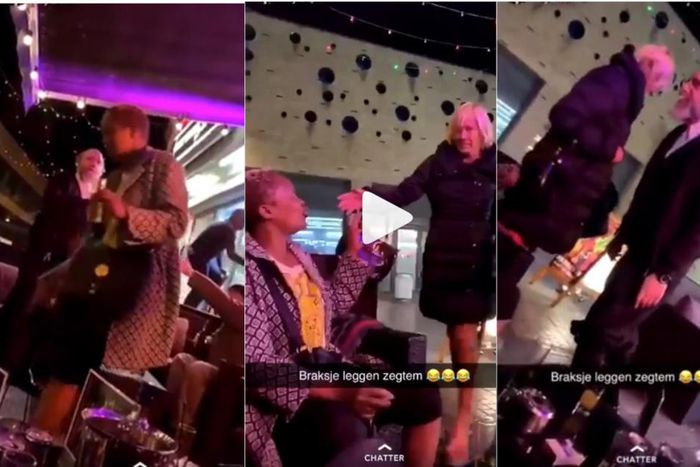 White man spits on black woman and hit her as others laugh and film the incident (video)