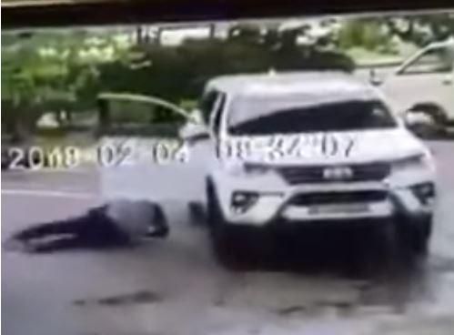 Hot tempered ‘big man’ almost overrun by his own posh car  at fuel station (Video)